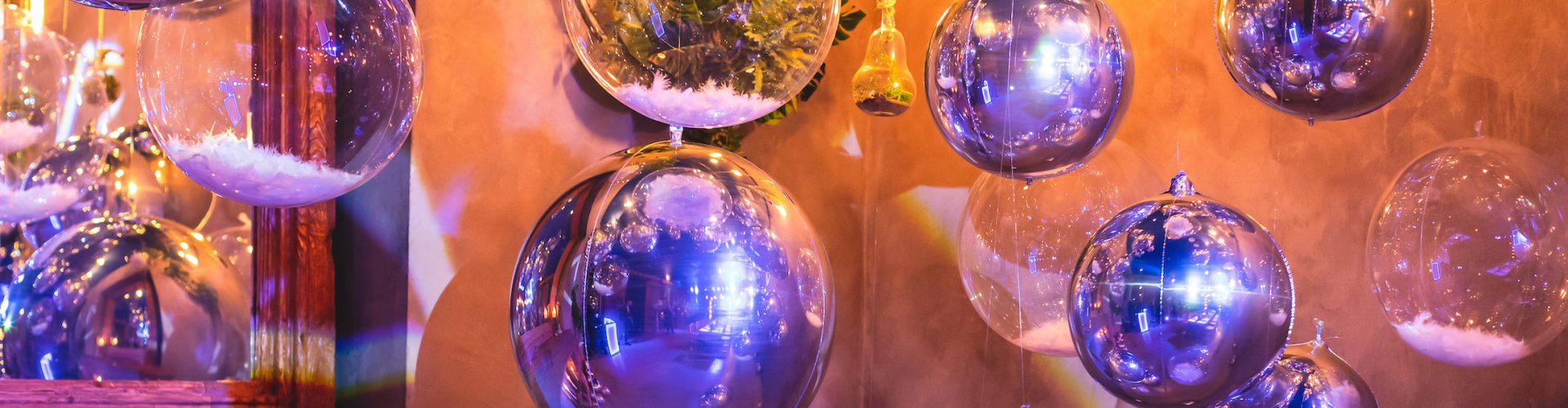 Decoration interior elements of restaurant venue banquet hall with multicoloured different helium balloons, on a indoor corporate event or wedding reception or a birthday party celebration